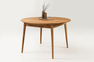 Escandi 6 round extendable dining table in solid oak | NordicStory