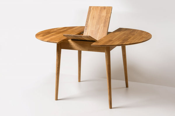 Escandi 6 round extendable dining table in solid oak | NordicStory