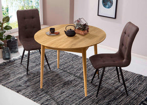 Escandi 6 round extendable dining table in solid oak | NordicStory