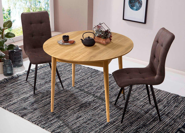 Escandi 6 round extendable dining table in solid oak | NordicStory